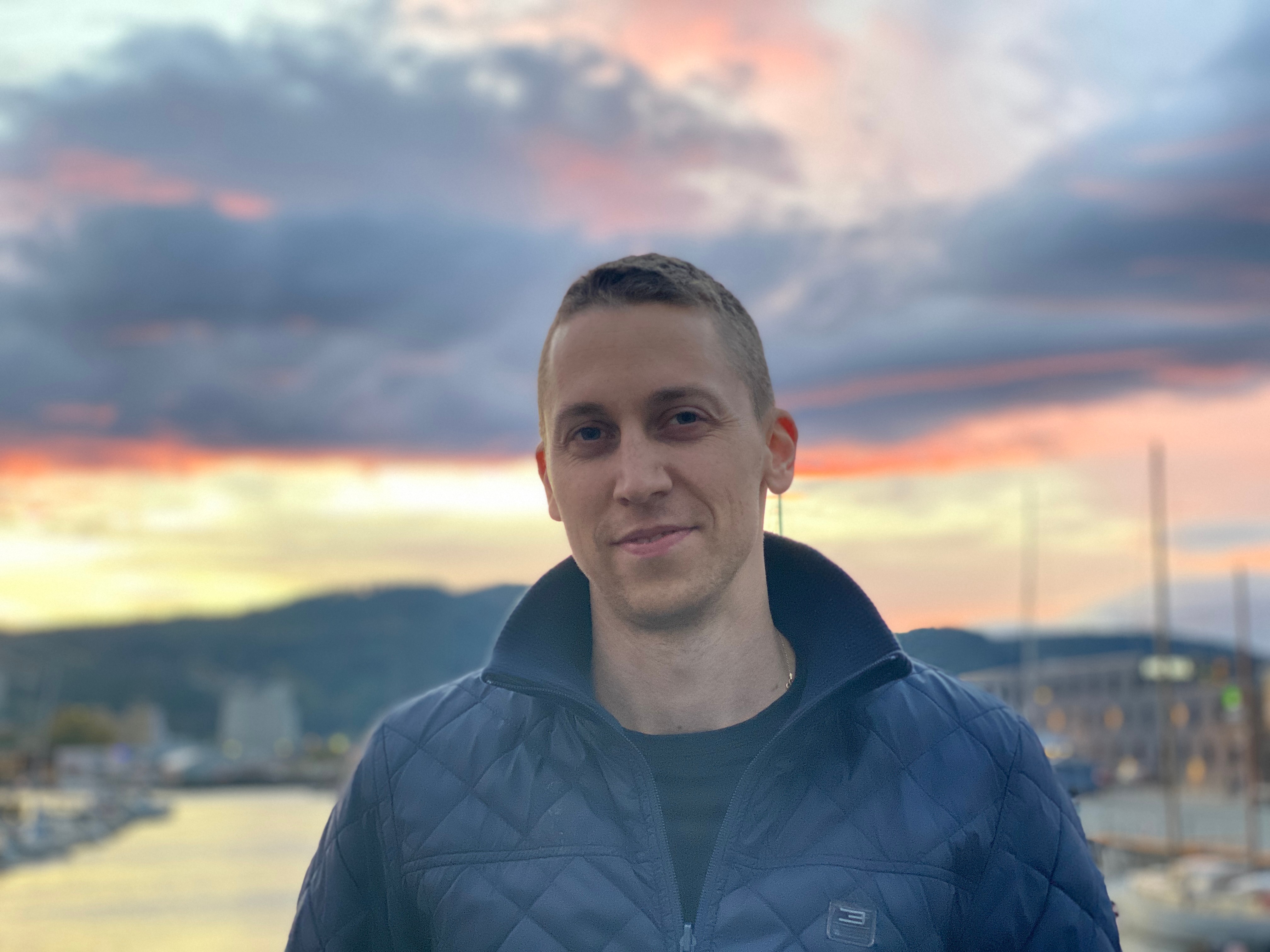 Stylized blue duotone portrait of a woman with long hair facing slightly backward